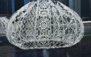 Crochet installations resembling sea urchins play with light