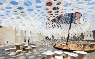 Lumen: photo-luminescent canopy that reacts to light, heat and movement
