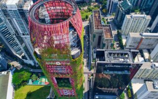 This skyscraper with aluminium mesh façade combines architecture and nature