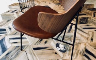 Circular floor tiles made out of railroad beams