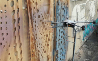 A mural created by mud-spraying drones