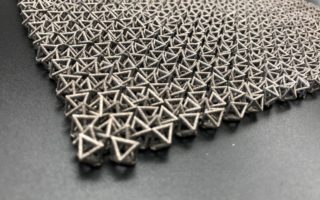 Chain mail-like material transforms from flexible to rigid upon impact