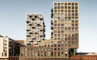 A high-rise building made of repurposed urban waste
