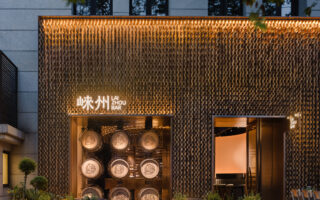 A distillery’s bar interior made of discarded distillery barrels