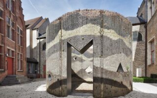A pavilion made of metal grid and various material layers