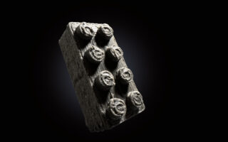 Building on the moon with LEGO bricks made of meteorites