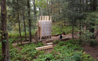 A pavilion made of a stack of lumber