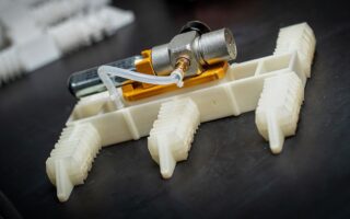 Electronics-Free Walking Robots Printed in One Go
