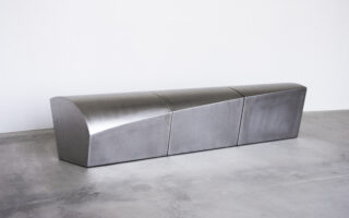 Presence: A Sculptural Stainless Steel Bench Celebrating Human Warmth