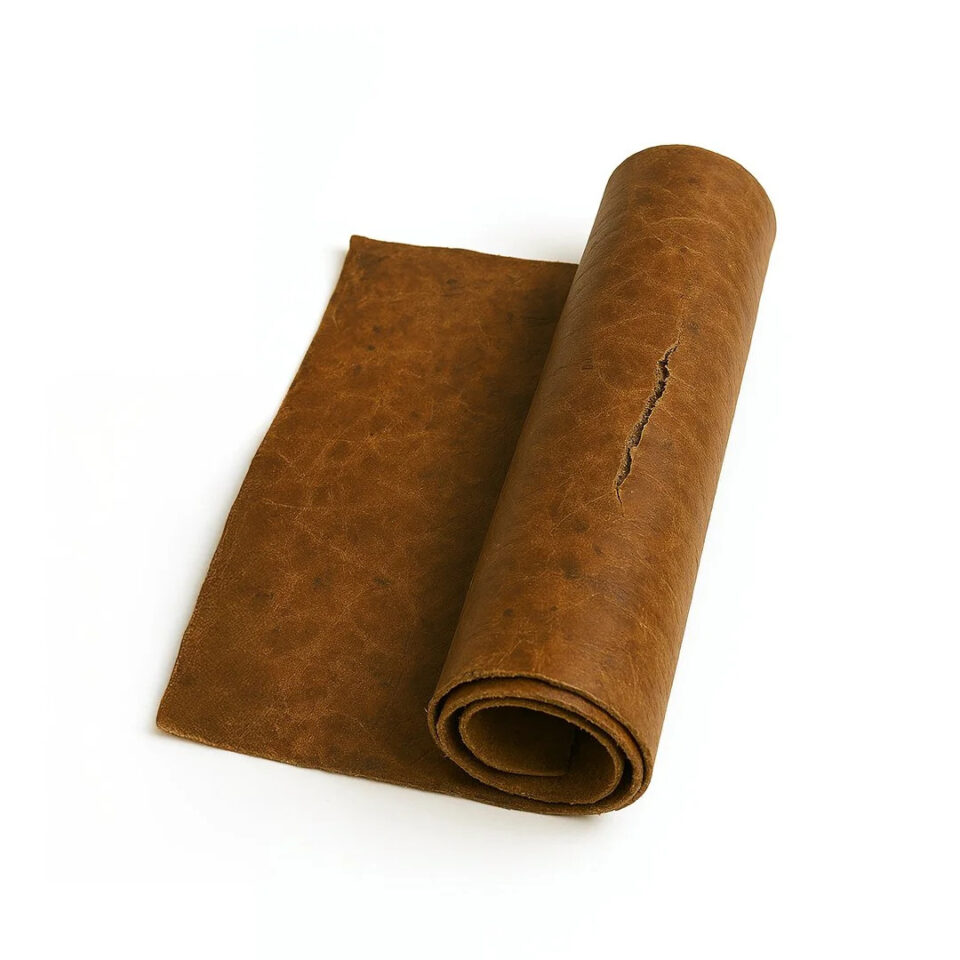 Rolled piece of tan leather with visible creases