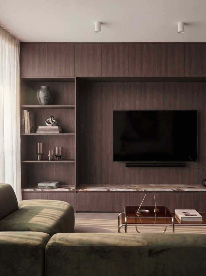Living room wall unit in a dark brown wood decor with shelves and a television