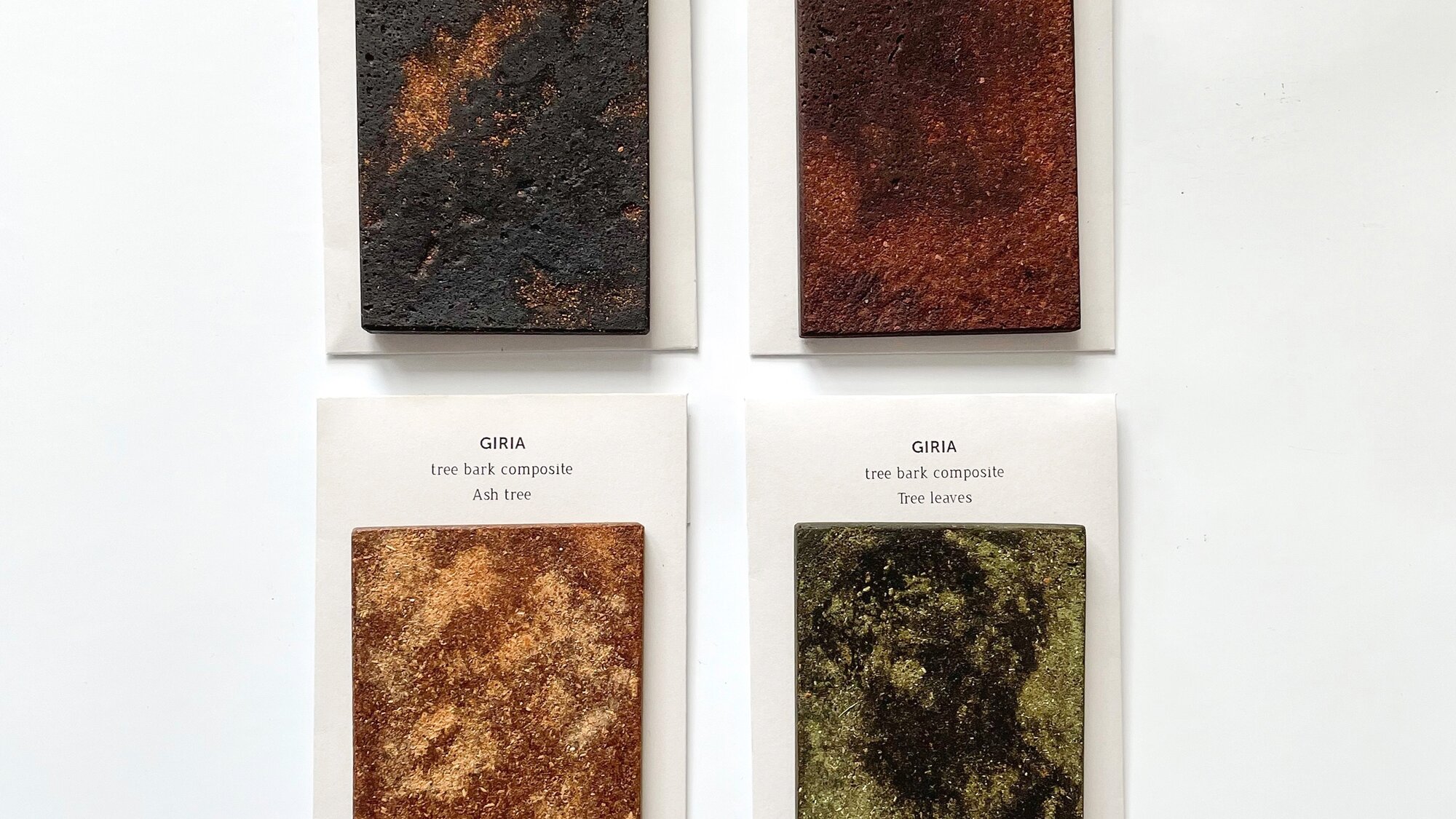 Four sample cards with tree bark composite in black, red, ochre and green tones