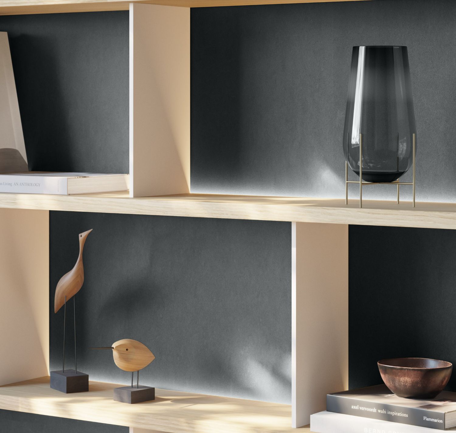 Light wooden shelves in front of a dark grey velvety back panel